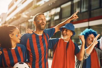 Happy sports fan and his friends have fun while going on soccer match and shouting  on the street.