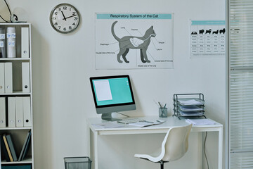 Horizontal image of workplace with computer monitor of vet doctor at vet clinic
