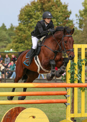 A girl and her horse in show jumping, Gotland Sweden.