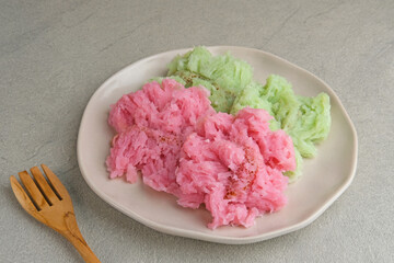 Kue Bikang or Carabikang is one of the traditional cakes typical of Central Java, Indonesia which is made from rice flour dough and coconut milk. Served in plate. 