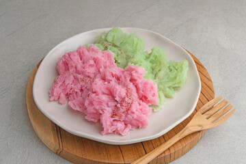 Kue Bikang or Carabikang is one of the traditional cakes typical of Central Java, Indonesia which is made from rice flour dough and coconut milk. Served in plate. 