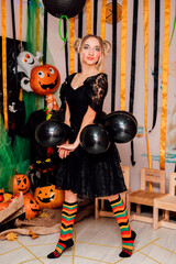 Young Sexy Funny Witch on Halloween Party