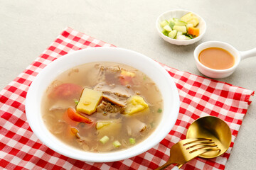 Soup, Sop Daging with vegetables is Indonesian traditional food, served in bowl