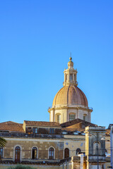 Fototapeta na wymiar View of the cupola of San Nicolò l'Arena in Catania, Sicily against blue sky