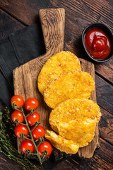 Hash brown potato, Potato Patties on a wooden board with ketchup. Wooden background. Top view - obrazy, fototapety, plakaty
