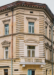 Corner of an old architectural building with stucco and balcony. Property. Home. Balcony. Tourism. Real Estate. Residential. Vintage. Wall. Classical. Estate. Real. Baroque. Center. Front