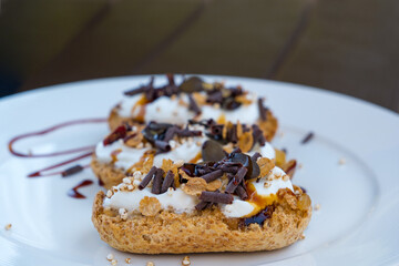 Open sandwiches with ricotta, puffed quinoa grains, honey, chocolate, seeds and maple syrup. Healthy, nutritious and gluten-free breakfast meal. Vegetarian toasts for breakfast
