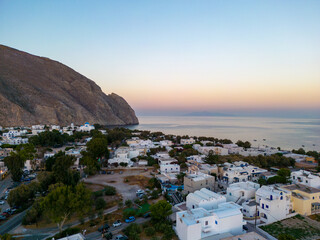 Perissa Aerial View at Sunrise. Famous Volcanic Beach and Bay of Perissa Village, Santorini Island, Cyclades, Greece. 