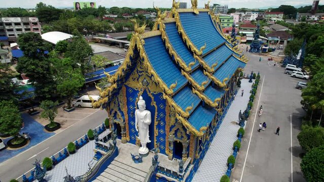 Aerial drone footage of the blue temple in Chiang Rai. Buddha religion temple architecture. Asian temple.