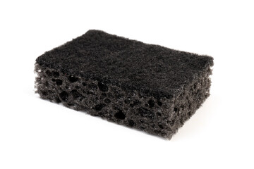 Black sponge used for washing dishes. Has two surfaces which are rough and smooth.