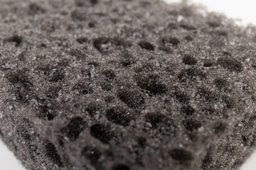 Sponge textured background. Black. Close up.