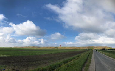 Fototapeta na wymiar polder and lighthouse, , coast, dunes, julianadorp, netherlands, clouds, 