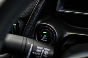 Close up engine car start button. Start stop engine modern new car button,Makes it easy to turn...