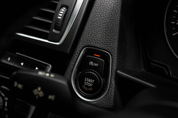 Close up engine car start button. Start stop engine modern new car button,Makes it easy to turn your auto mobile on and off. a key fob unique ,selective focus	