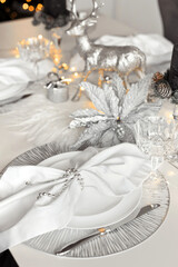 Fashion christmas decoration on table settings in white, gray and silver color