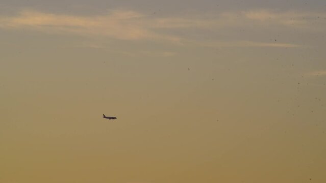 Airplane flying at dusk preparing for descent