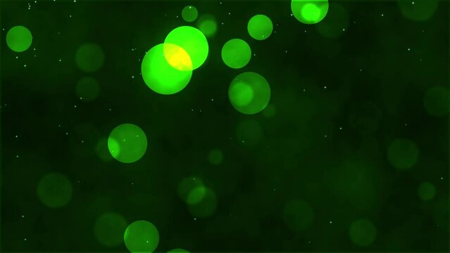 Animated background with lights and light particles on blurred background. Abstract animation with green light particles floating across the screen