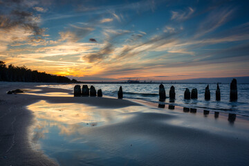 Sunset on the beach of the Baltic Sea in Gdansk, Poland