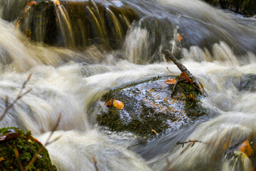 Photo of water flowing in a river during autumn