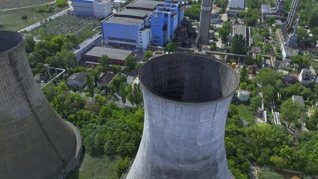 Two Large Natural Draft Wet Cooling Hyperboloid Towers At HeidelbergCement Militari Concrete Plant In Bucharest, Romania.