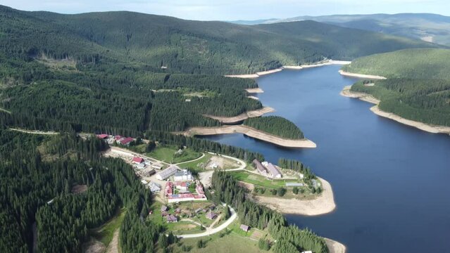 aerial footage of the monastery and Oasa lake in Romania