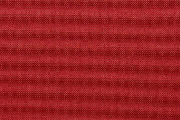 Fototapeta premium Vibrant rich red flat hardback book cover dimples nodules pattern all in rows filling the frame 
