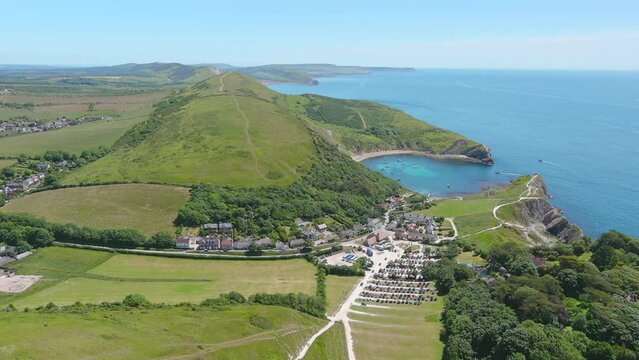 Lulworth Cove, UK: Aerial view of picturesque cove on Jurassic Coast - landscape panorama of United Kingdom from above