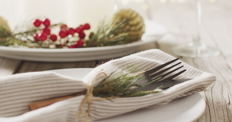 Image of christmas place setting with cutlery on grey background