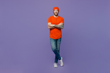 Full body young smiling european man 20s he wear red hat t-shirt hold hands crossed folded look...