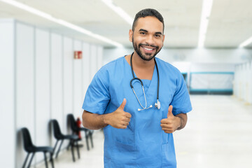 Happy hispanic male nurse or doctor