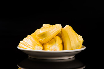 fresh ripe jackfruit peeled fruit isolated on black background.