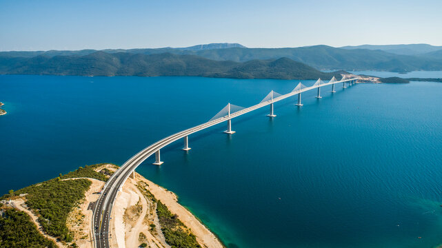 Aerial view of Peljeski bridge, a suspended railroad and highway crossing the Bay of Mali Ston in Croatia.