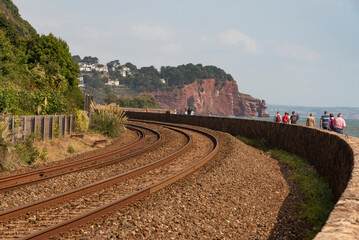 Fototapeta na wymiar Teignmouth, Devon, England, UK. 2022. Railway tracks running along the south Devon coast at Teignmouth looking east towards Dawlish.