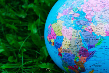 Earth world globe on grass