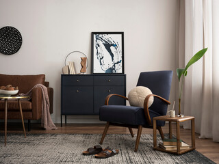 Elegant interior with mock up poster frame, blue armchair, commode, brown sofa, carpet, decoration,...