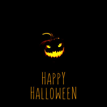 Smiling Halloween jack-o-lantern pumpkin on black background with Happy Halloween message.
