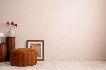 Minimalist composition of elegant and outstanding space with copy space, brown pouf, poster, wooden...