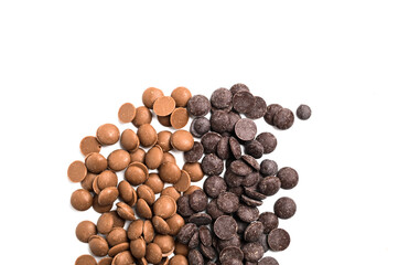 Close up of dark and milk couverture chocolate isolated on white. Chocolate callets isolated on white.