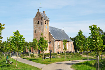 Fototapeta na wymiar The late Romanesque church of Westernijtsjerk Friesland in The Netherlands was built in the 13th century. Today the church is mainly used for exhibitions and concerts.