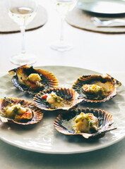 Grilled scallops with olive oil, garlic and parsley. Galician style of scallop dish (Vieira). Typical Zamburiñas dish from Galicia, spain, Delicious Spanish tapas food