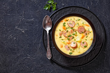 German potato soup with sausages in bowl