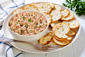 classic ham salad with crackers on white plate