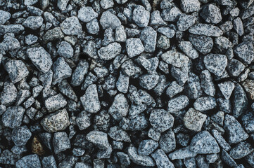 Rock texture background. Gray granite gravel from rubble. Garden gravel stone for landscaping design