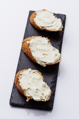 baguette cream cheese sandwich on a white background