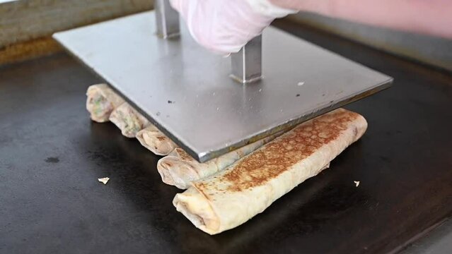 4K: A chef toss the shawarma in saj bread, the most popular Arabic street food in the world