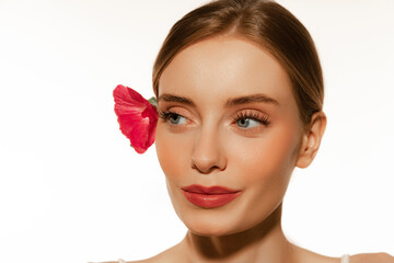 Fototapeta premium Closeup portrait of beautiful young girl with clean well-kept skin isolated over white background. Skin care. Facial treatment. Cosmetology, beauty and spa.