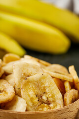 delicious dried banana on a black wooden rustic background