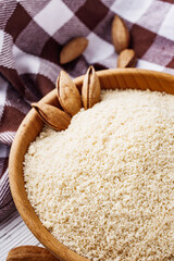 almond flour on a white wooden rustic background
