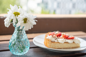 A beautiful dessert of sponge cake and cream with strawberries