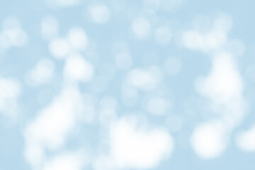 Abstract light blue blur bokeh for background, light blur on high light blue gradient abstract background in central design for presentation.
